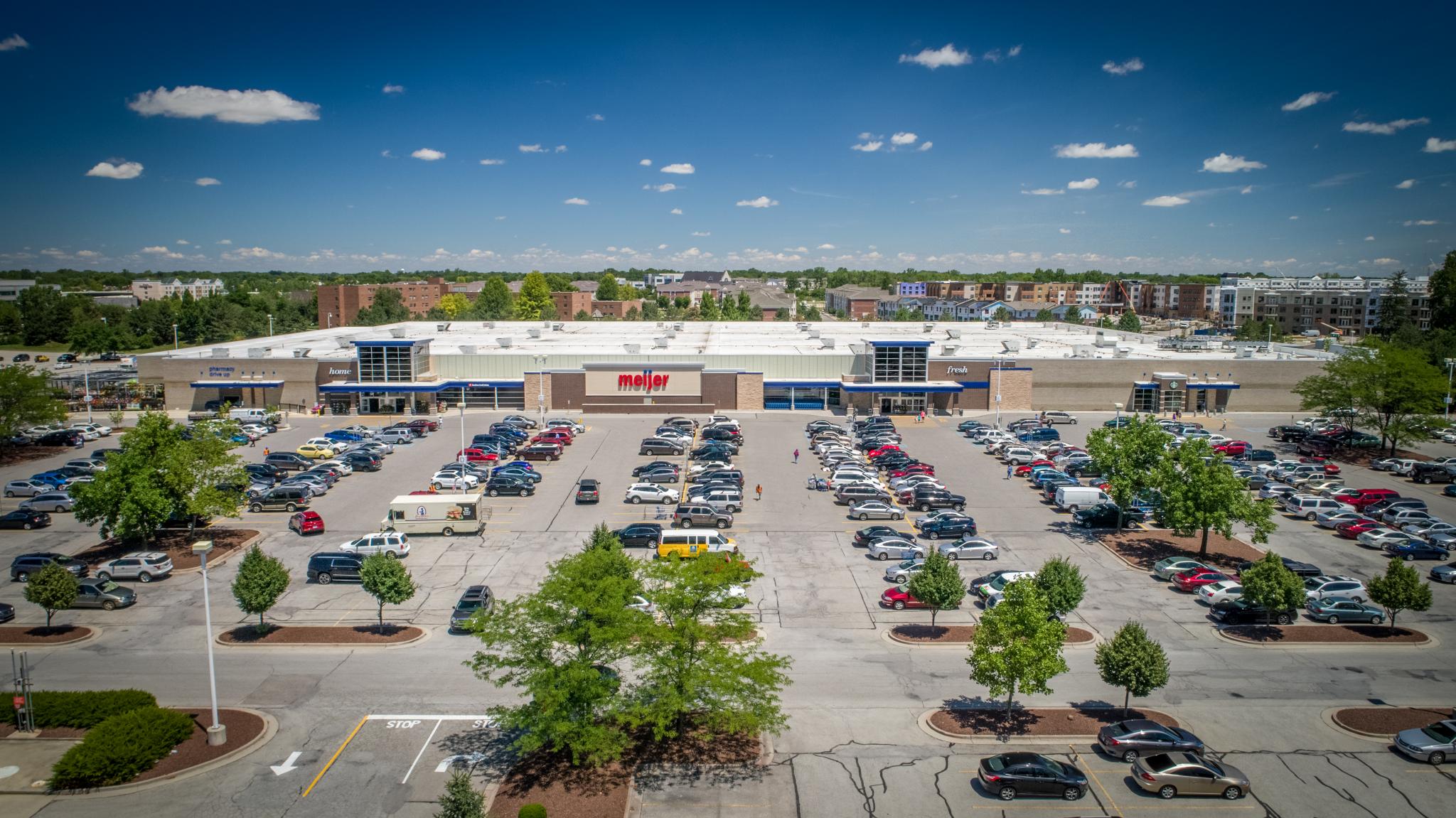photo of a wide shot of the parking lot of a grocery store